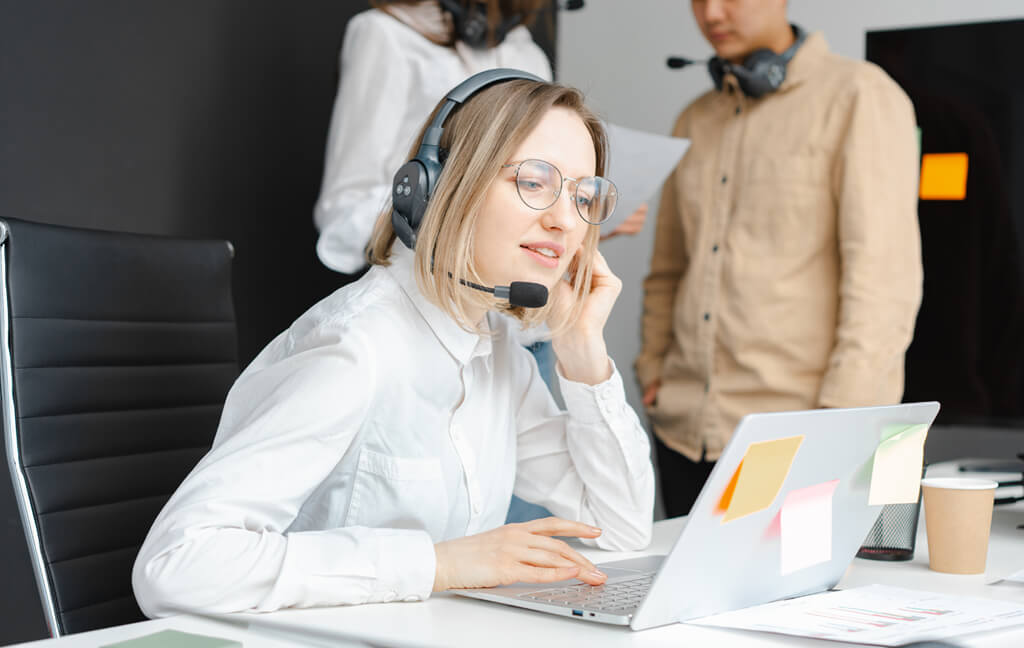 People reviewing software at a workstation
